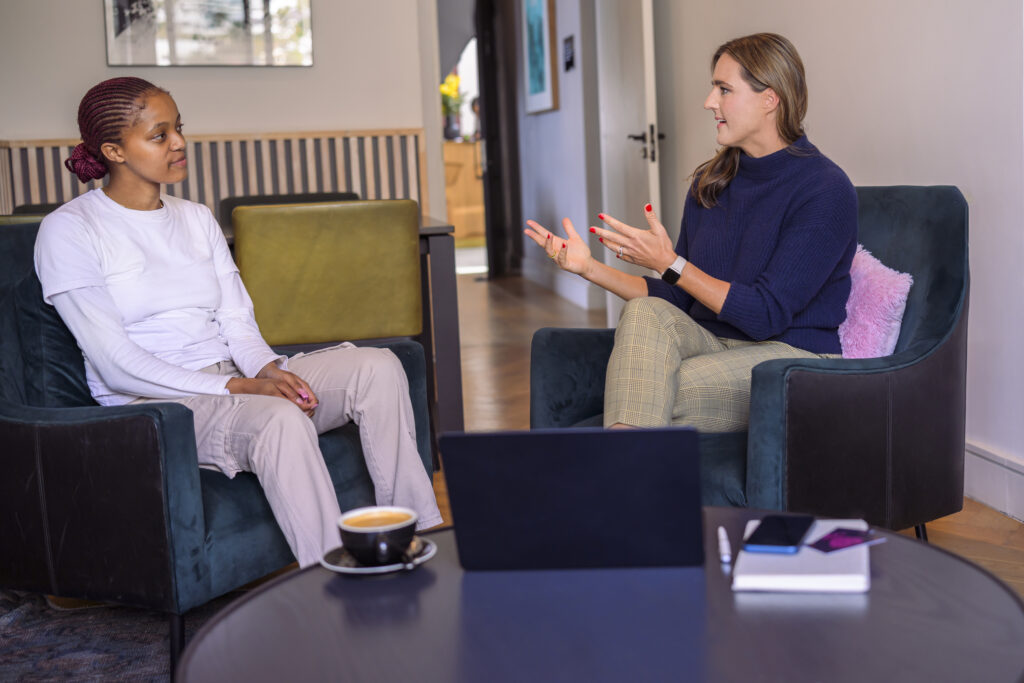 Dr. Kerstin Brehm in a 1:1 career coaching session, providing strategic guidance to a high-achieving professional. The image symbolizes personalized career transformation, leadership coaching, and professional growth.