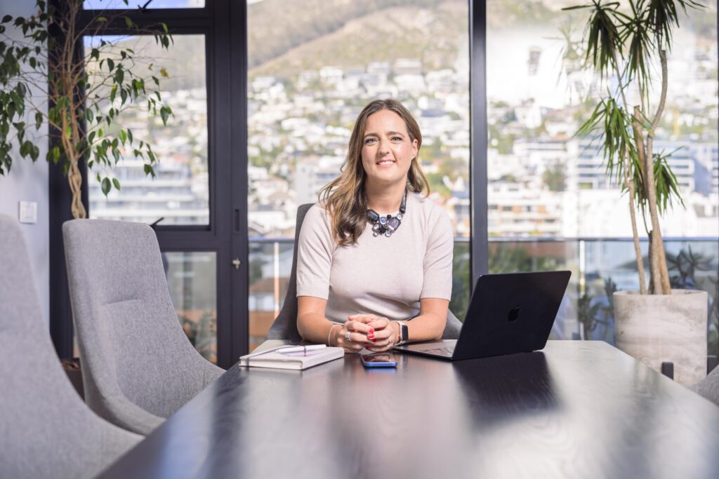 Professional woman working on a laptop with multiple projects and income streams, representing the concept of a portfolio career and career flexibility.