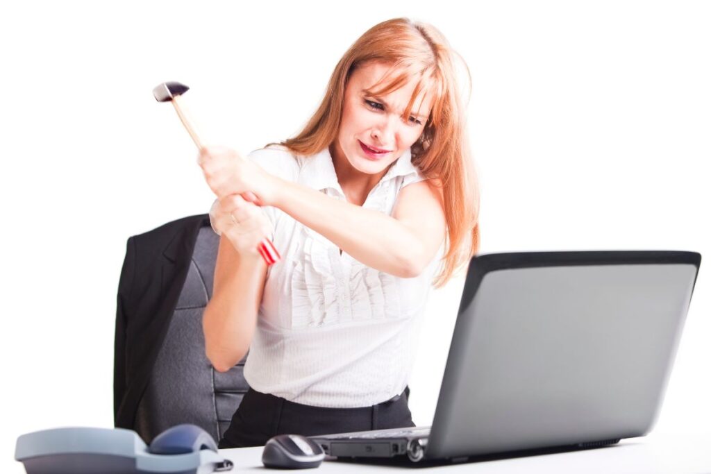 Women Smashing Laptop because she hates her job
